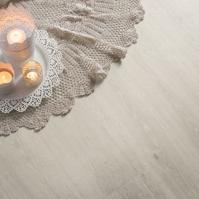 Arrangement of candles featuring a white oak wood effect floor