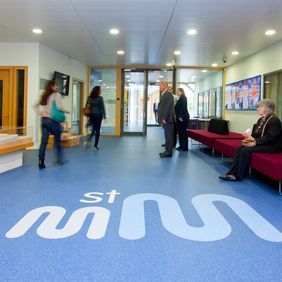 Blue flooring in a school reception area