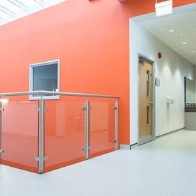 Corridor in a commercial building with light coloured flooring