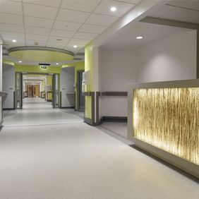 Hospital corridor with light coloured flooring