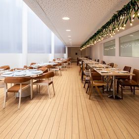 Dining area in a restaurant with wood effect flooring 