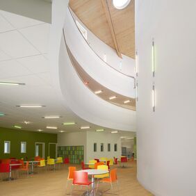 Light coloured oak effect flooring in a public dining area