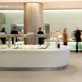 Neutral coloured safety flooring with a decorative chip in a hotel buffet area