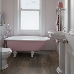 Powder Pink bathtub, bathroom, Window, dark oak flooring
