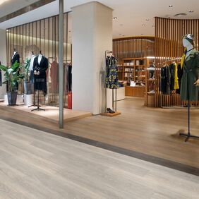 High end retail store, mannequins, oak flooring