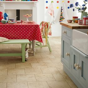 Cottage style kitchen with stone effect tile flooring 