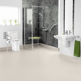 Neutral coloured flooring in a large adapted wetroom 