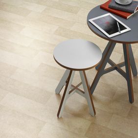 Round table and stool featuring light stone effect flooring 