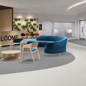medical reception with grey floors and blue chair 