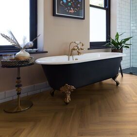TLC Massimo in Golden Oak Large Parquet laid in a bathroom