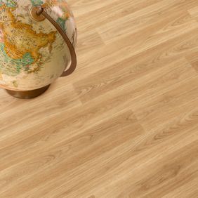 Close up image of light oak effect flooring with a globe ornament