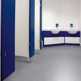 Public toilets with grey flooring