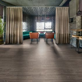 Dark oak effect flooring a in a trendy restaurant
