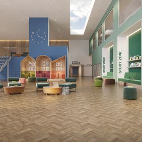 Oak effect parquet flooring laid in a modern school seating zone