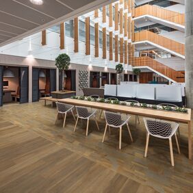 Oak effect flooring laid in a commercial building seating area
