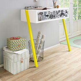 Light oak wood effect flooring and a side console table and accessories 
