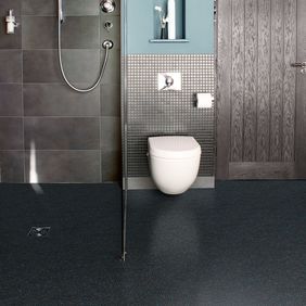 Black colour safety flooring in a bathroom with walk in shower 