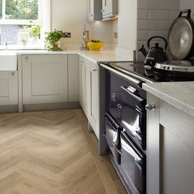 Oak effect flooring laid in a residential kitchen in parquet design