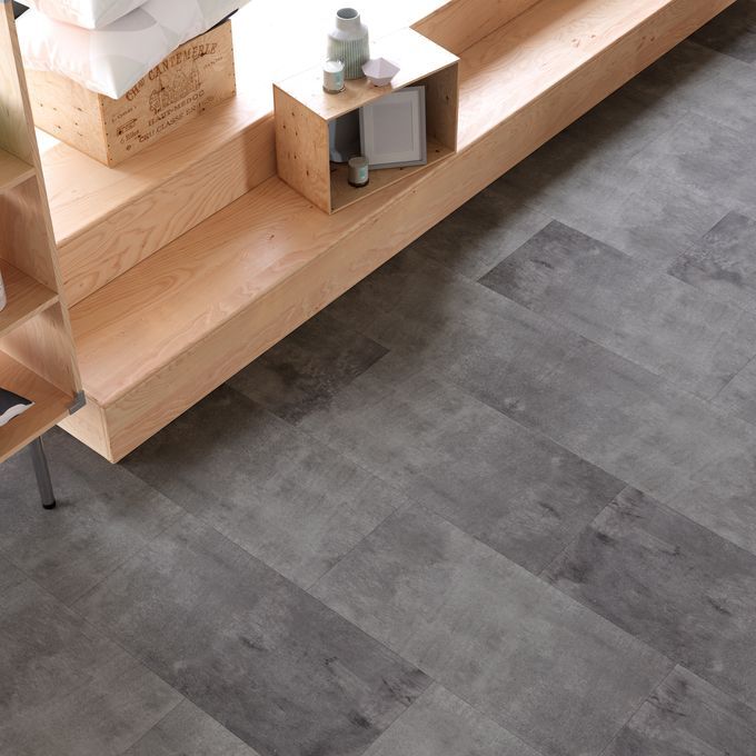 upclose image of dark grey coloured flooring in a homewaer retail store