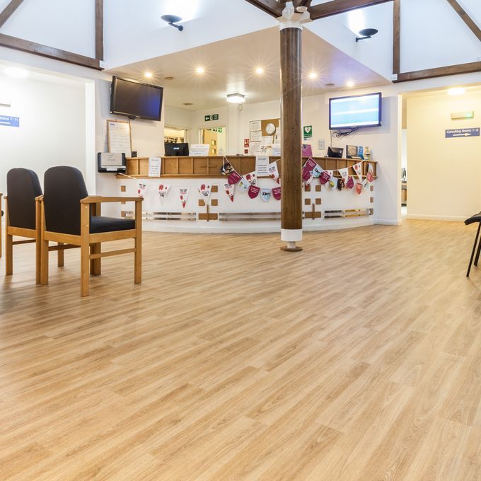 Light oak wood effect flooring in a Doctors reception area