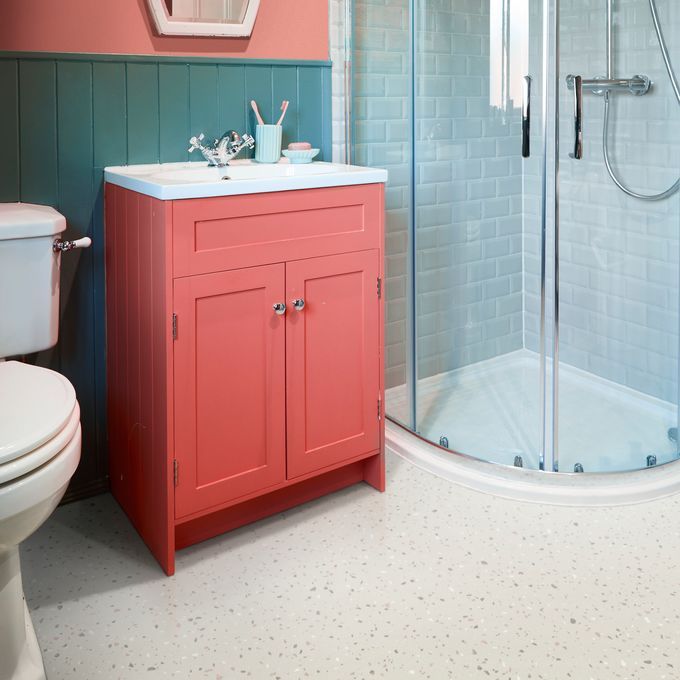 Light coloured flooring in a bathroom with a walk in shower