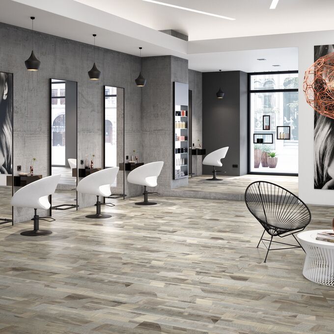 Wood effect flooring laid in a modern style hairdressers