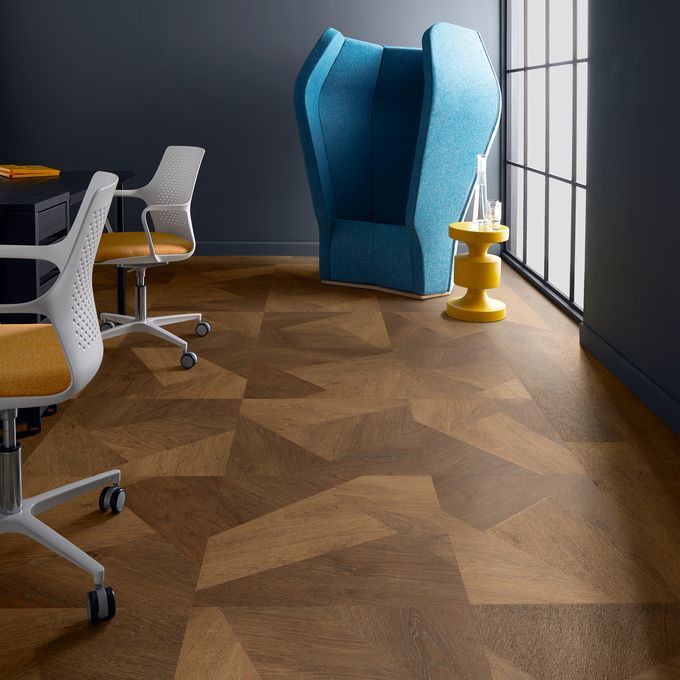 Dark oak prism effect flooring laid in a room with chairs