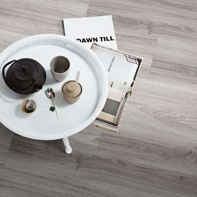 Side table, Coffee, cups, magazines, grey oak effect flooring 