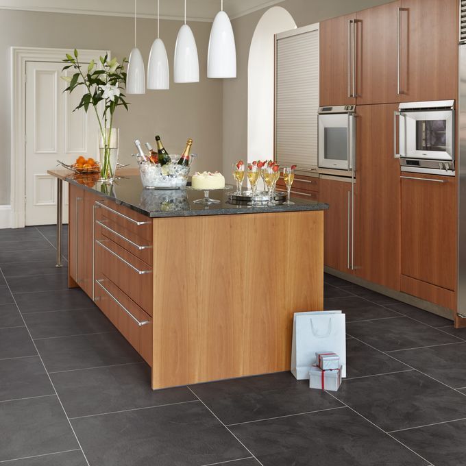 Modern kitchen with centre island featuring the Atlantic Slate in large square tile effect, laid brickwork with Pearl Grouting Strip. 