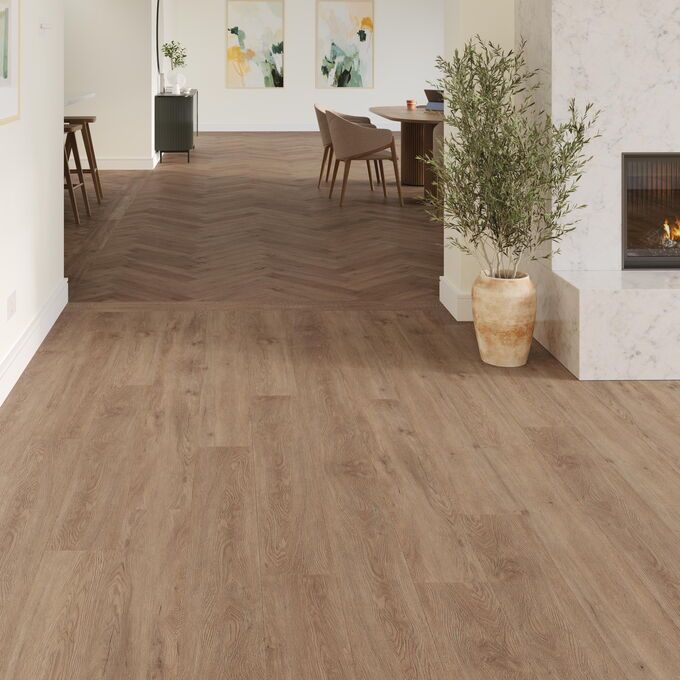 TLC Massimo in Warm Barnwood laid next to a fireplace with Warm Barnwood Large Parquet in the background.