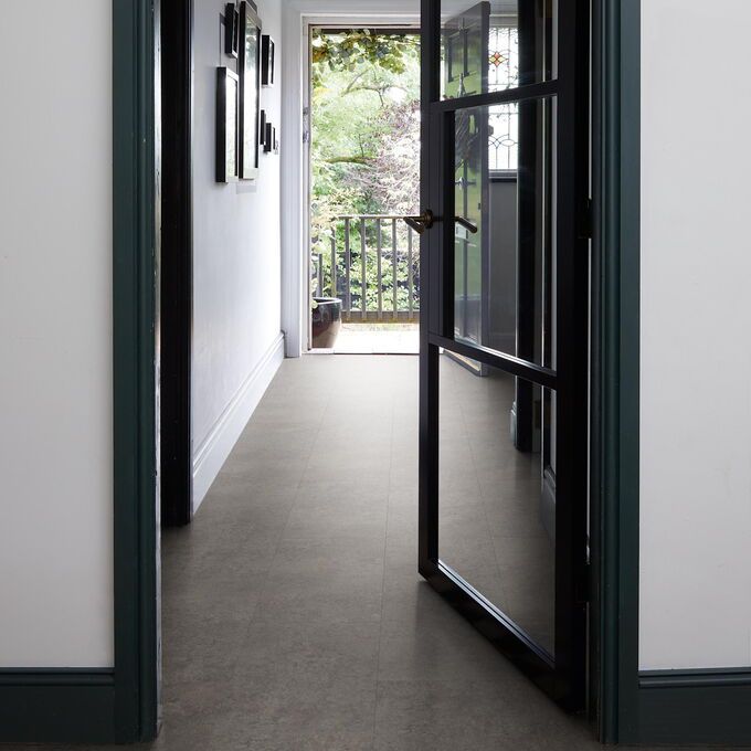 TLC Massimo in Caledonia Slate laid in a residential hallway