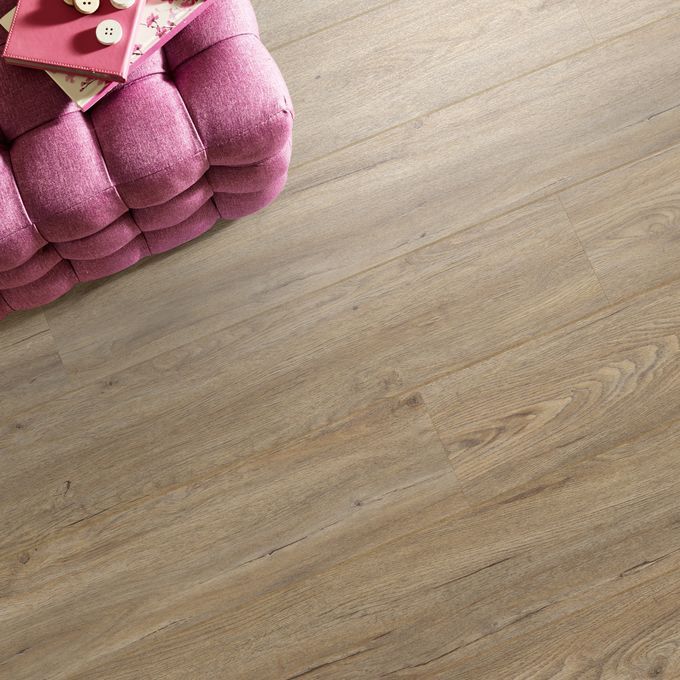 Close up of pouffe featuring light wood effect flooring Quayside Oak 