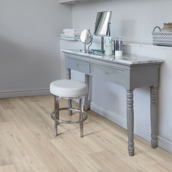 Grey dresser, stool, mirror, makeup, oak flooring 