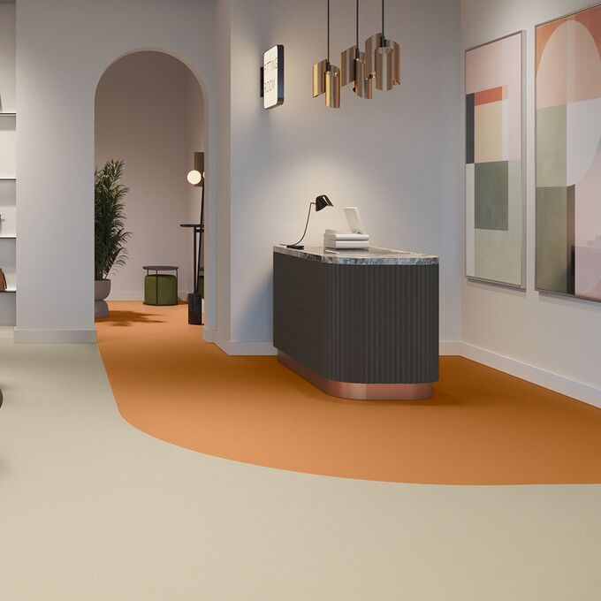 orange and cream floor in a retail shop with hand bags 