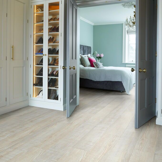 TLC Massimo in New England laid in a walk in closet leading to a bedroom