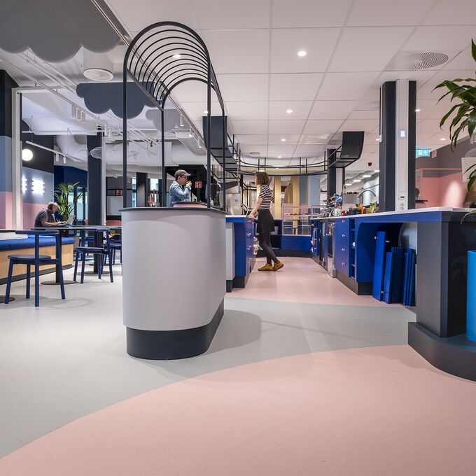 Chill out area with light grey and pink Polyflor flooring