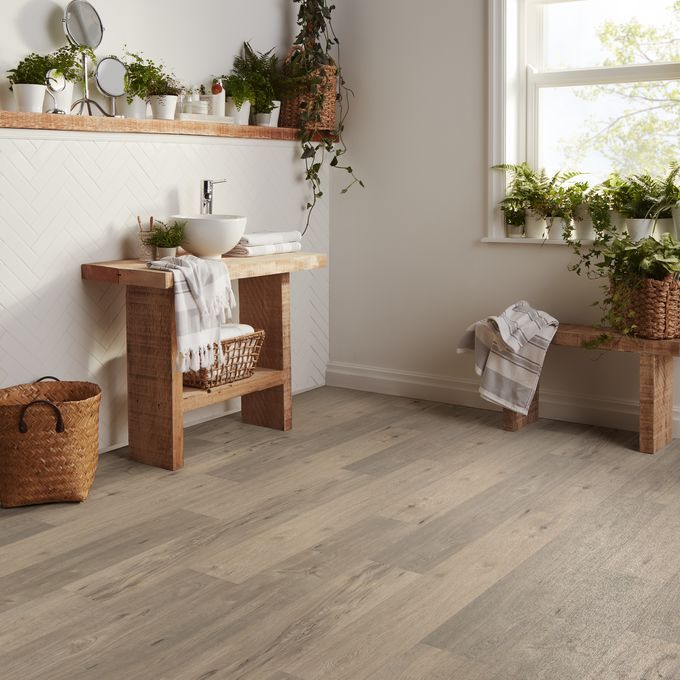 Bathroom with brown timber effect flooring