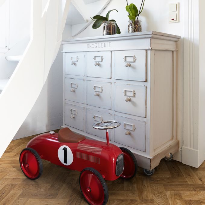  Oak parquet effect flooring in a hallway with white console table 
