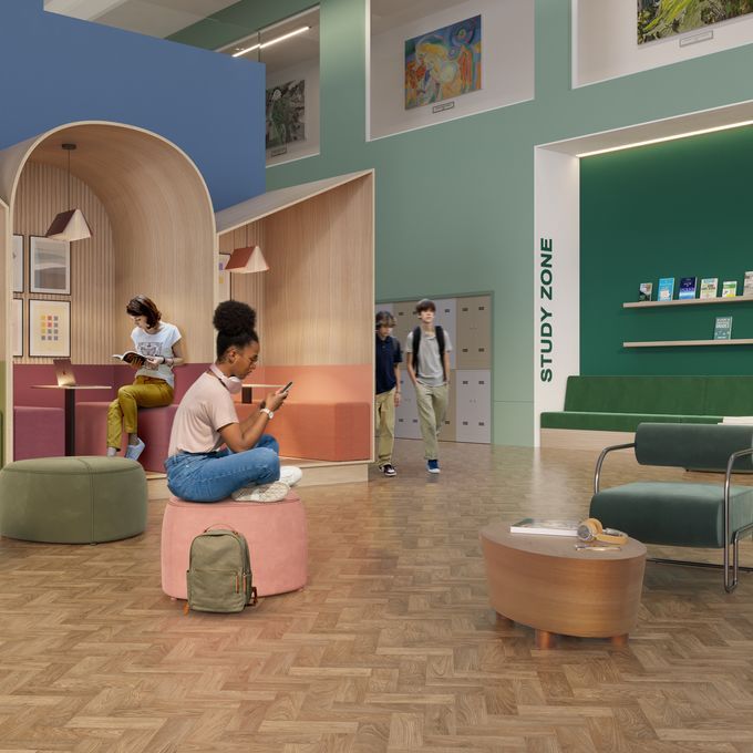 Oak effect parquet flooring laid n a student seating zone with people