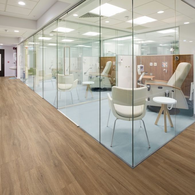 Modern treatment rooms with glass walls Oak flooring and Polysafe Verona flooring alongside 