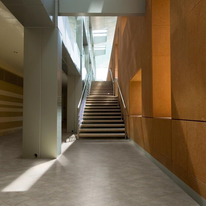 TLC Massimo in Smokes Sandstone in a hallway leading to a staircase