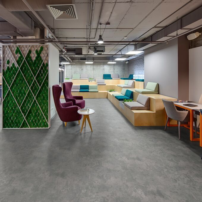 Concrete effect flooring laid in a trendy seating area