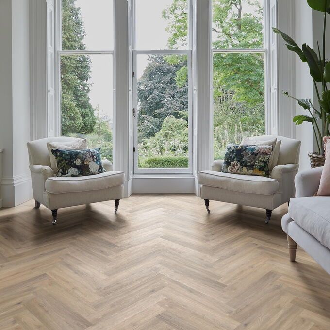 TLC Massimo in Blond Oak Large Parquet laid in a living room with cream furniture