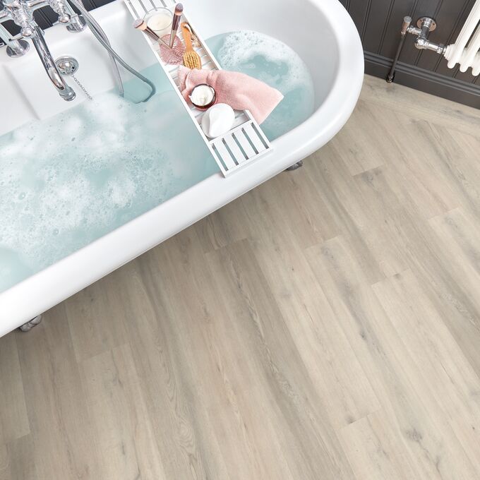 Bathroom, Bathtub, Bath tray, soap, light wood flooring 