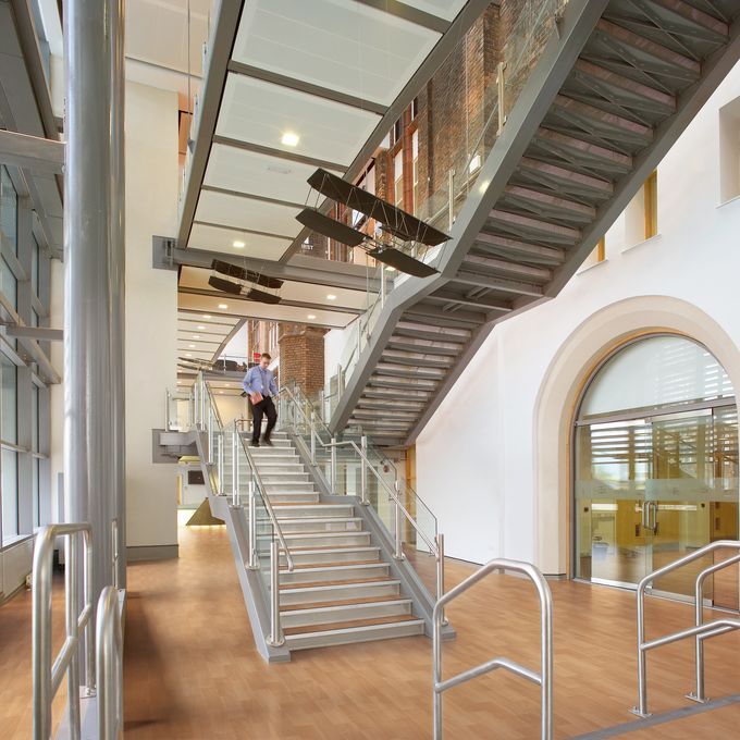 Commercial staircase in an open area with beech effect flooring