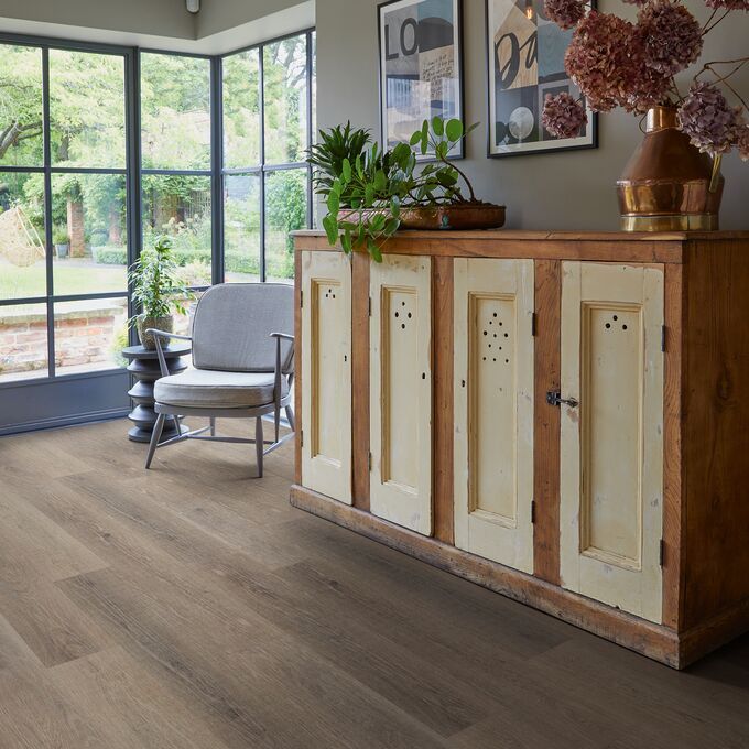 Dark oak effect flooring with large square glass panes