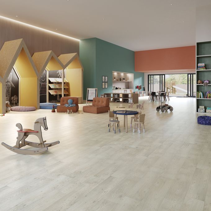 Oak effect flooring laid in a large nursery playroom