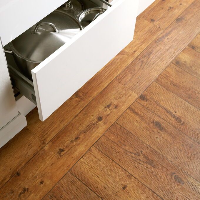 TLC Original in Rustic Oak laid in a kitchen next to drawers
