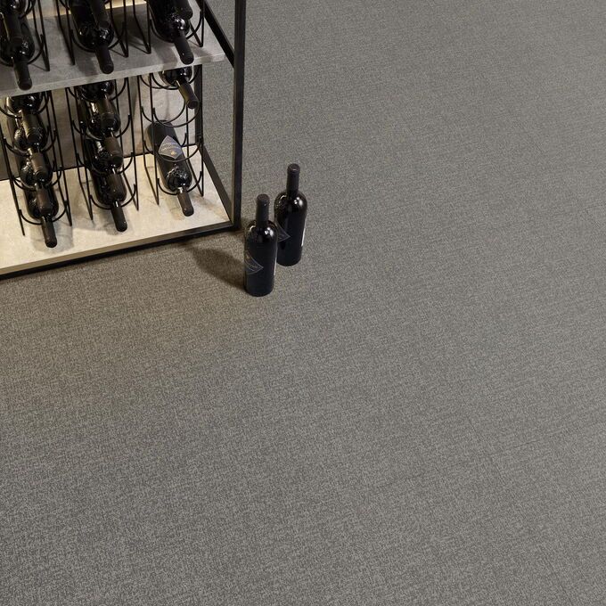 Polyflor Expona Fabrik in Dark Grey laid in a restaurant next to a wine shelf