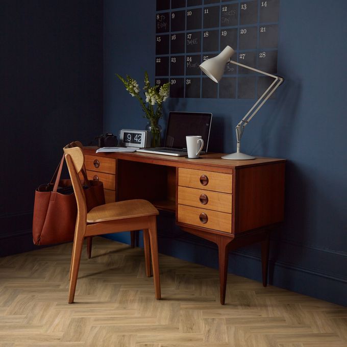 Home study with light wood effect flooring laid in a Herringbone pattern in third length planks